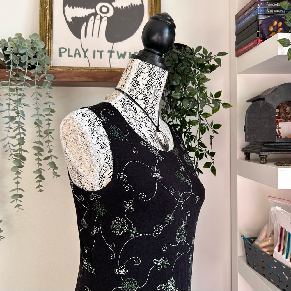 Black Sleeveless Dress with Green Floral Design